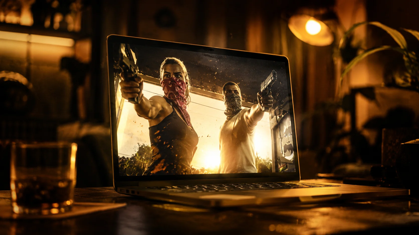 Laptop on a table displays two masked robbers pointing guns at the camera, in a scene lit in warm, dramatic tones.