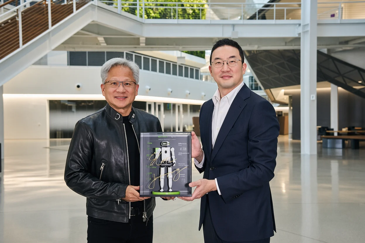 Two executives pose in a modern corporate environment holding a sign with the image of a humanoid robot and graphic elements related to artificial intelligence.